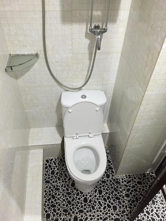 Primo Guesthouse Цзюлун Номер фото
